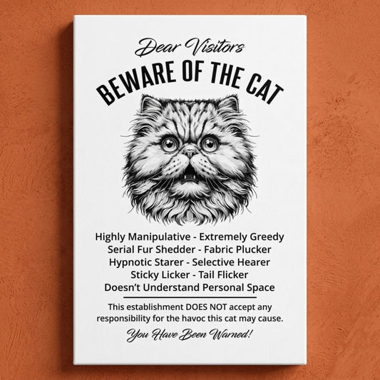 A rectangular white canvas sign with black printed funny text warning visitors about a Persian cat, featuring a black-and-white illustration and humorous behavioral descriptions. The canvas print is photographed against a orange wall.
