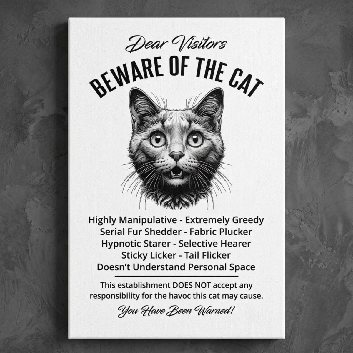 A rectangular white canvas sign with black printed funny text warning visitors about a Russian Blue cat, featuring a black-and-white illustration and humorous behavioral descriptions. The canvas print is photographed against a dark gray wall.