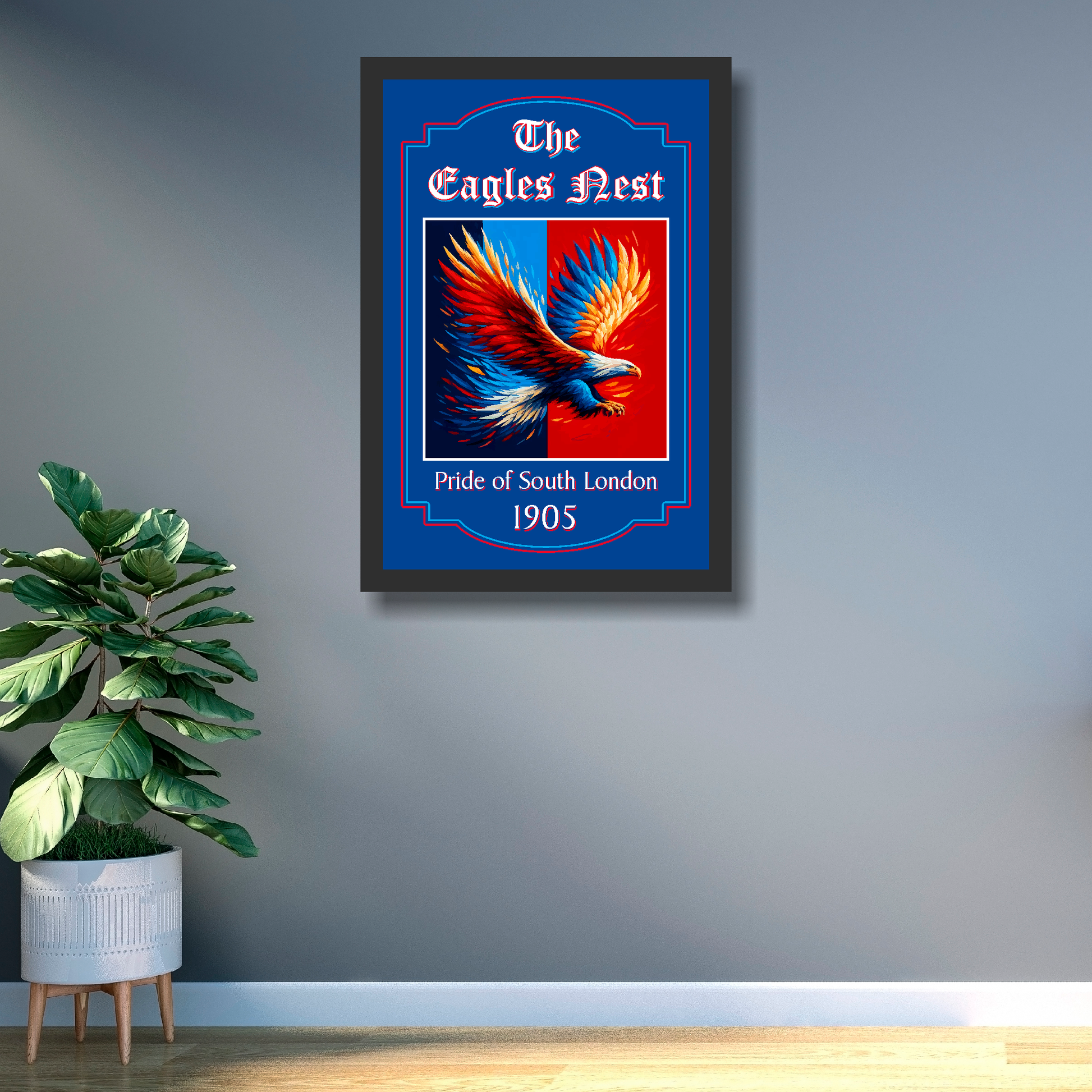 Framed artwork of an eagle with text 'The Eagles Nest, Pride of South London 1905' on a gray wall.