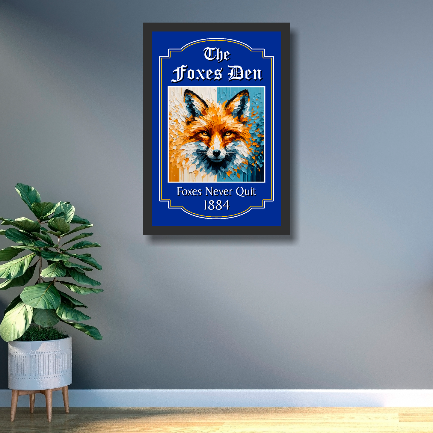 Leicester City black framed artwork of a fox with 'The Foxes Den' text on a wall next to a plant.