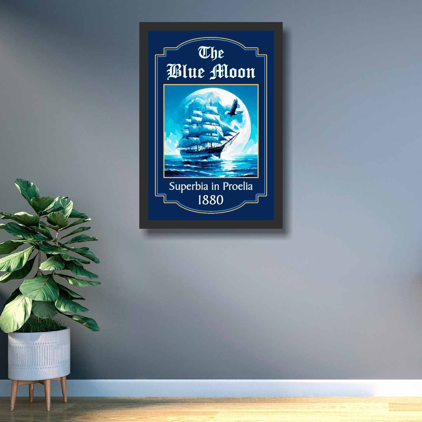 Man city inspired pub sign 'The Blue Moon' with a ship and moon illustration mounted on a grey wall in a black frame