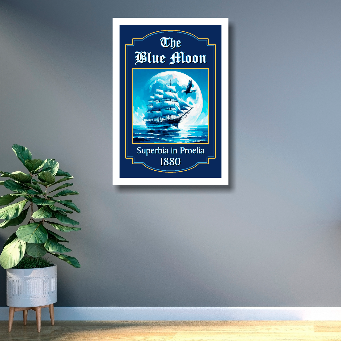 Man city inspired pub sign 'The Blue Moon' with a ship and moon illustration mounted on a grey wall in a white frame