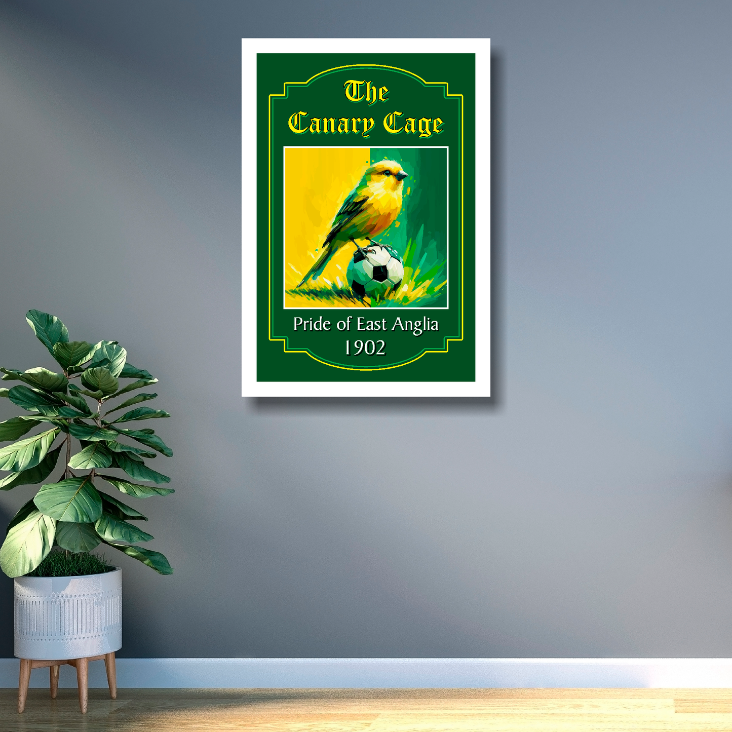 White framed Norwich City FC art print 'The Canary Cage' text, with a canary sitting on a football