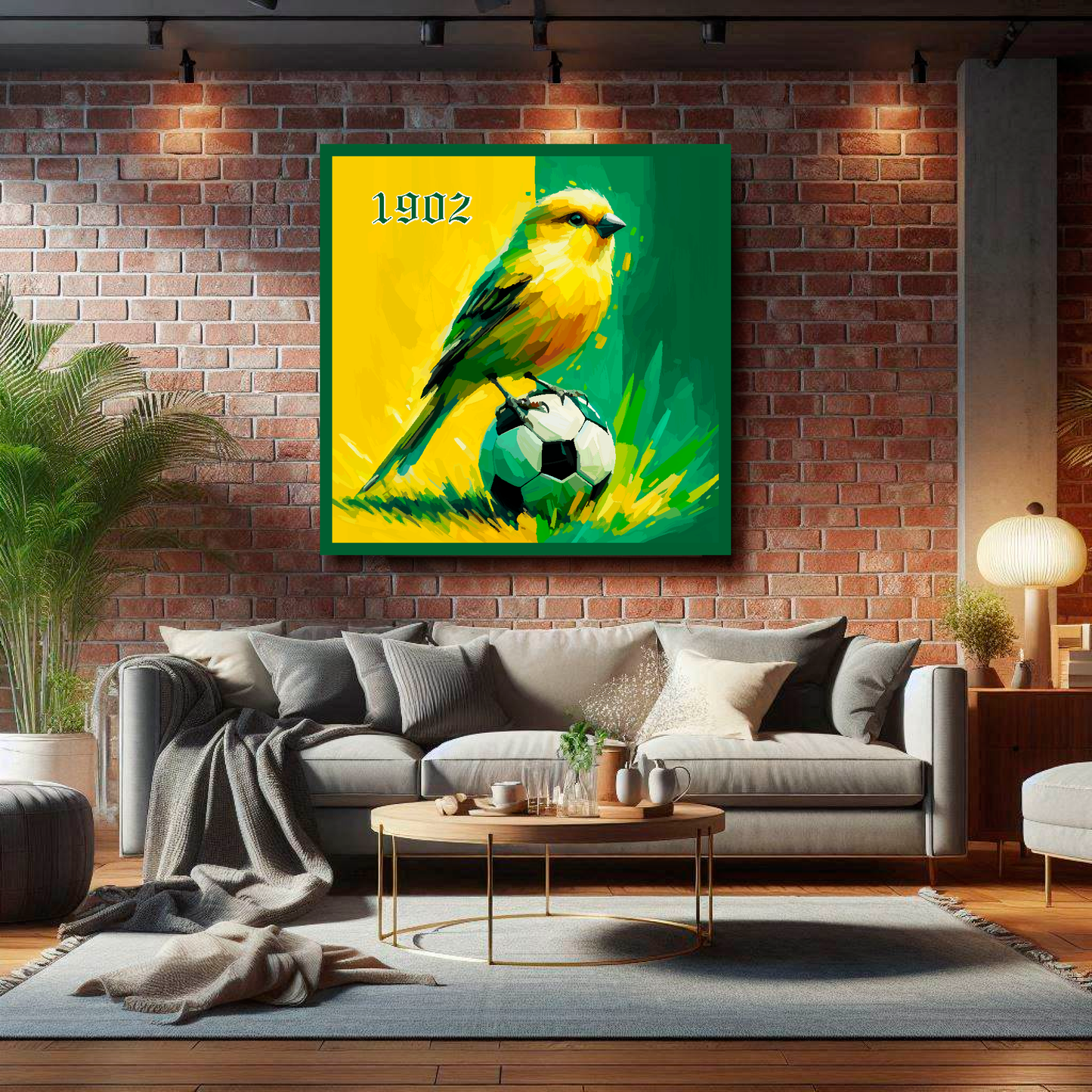 Large Norwich City inspired canvas on brick wall above grey sofa - bold UK football art living room