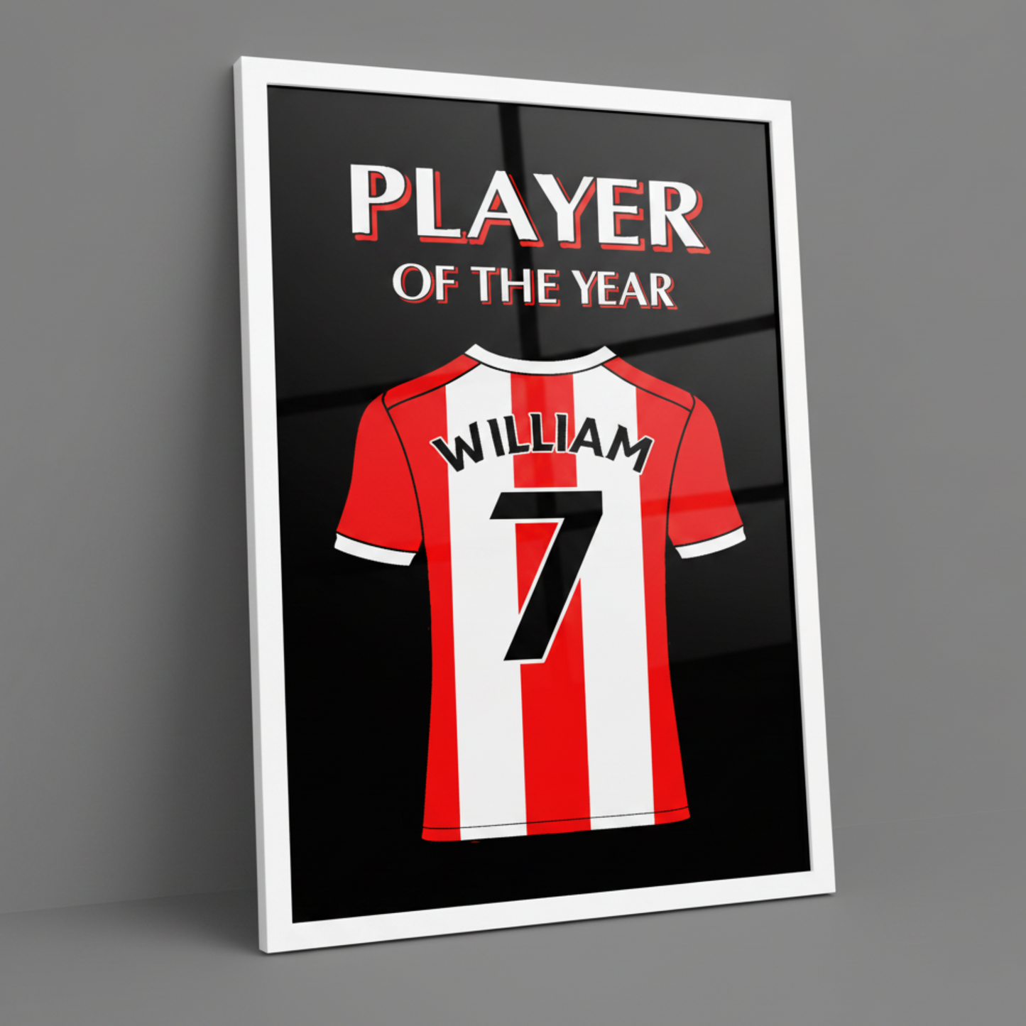 A framed art print featuring a red and white striped football shirt with the name WILLIAM and number 7 on the back, above the words PLAYER OF THE YEAR, shown on a gray background.