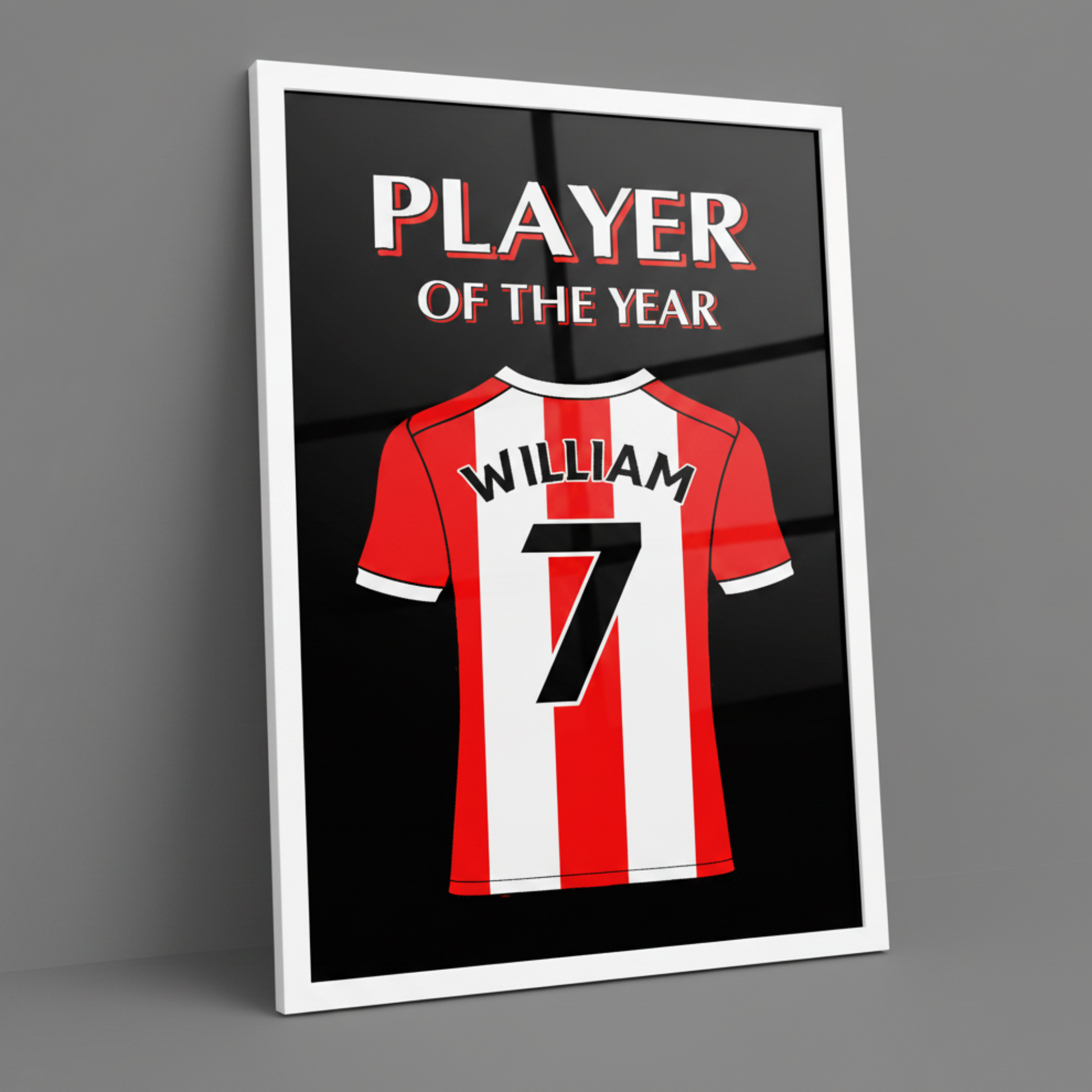 A framed art print featuring a red and white striped football shirt with the name WILLIAM and number 7 on the back, above the words PLAYER OF THE YEAR, shown on a gray background.